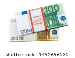 Small photo of Euro cash in bundles of one hundred and two hundred banknotes, Euro money Euro on a white background, isolated on a white background