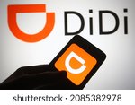 Small photo of KYIV, UKRAINE - DECEMBER 03, 2021: In this photo illustration Didi Chuxing Technology Co. logo is seen on a mobile phone screen.