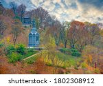 Small photo of Scenic view of Saint Vladimir Monument on Vladimir's Hill at autumn day, Kyiv, Ukraine. Lush autumn foliage. Saint Vladimir Monument is popular touristic symbol of Kyiv, capital of Ukraine