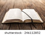 Open Book On Wood Background