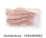 Top view of frozen pollock fillet in airtight clear plastic bag isolated on white