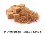Small photo of Pile of brown granulated sugar and sugar cubes isolated on white