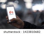 Small photo of PHUKET, THAILAND - JUN 7, 2019: hand holding smartphone with screen of huawei logo, Google blocks Huawei’s access to Android updates on may 20 and US delays Huawei ban for 90 days afterward