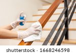 Small photo of Deep cleaning for Covid-19 disease prevention. alcohol,disinfectant spray on Wipes of Banister in home for safety,infection of Covid-19 virus,contamination,germs,bacteria that are frequently touched .