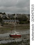 A Red Boat On Low Tide In...