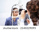 Female doctor ophthalmologist...