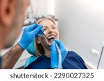 Smiling dentist communicating...