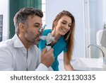 Small photo of Adult man testing breathing function by spirometry having health problem. Diagnosis of respiratory function in pulmonary disease.