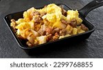 Small photo of Hearty Breakfast Delight: Top-View Close-up of Scrambled Egg with Sausage and Potato Medley