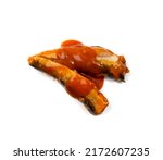 Small photo of Fish in tomato sauce isolated. Fried herring, sprat fillet, canned mackerel with ketchup, saury in red sauce on white background top view