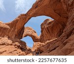 Scenic view of Double Arch red rock formation at Arches National Park in Moab, Utah. Tourist attraction.