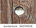 A Hole In A Wooden Fence. 