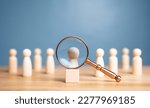 Small photo of Human Resource Management or HRM. Magnifier glass focus on wooden figures intend to manager which is among staff. Talent management, Recruitment employee, Successful business team leader concept