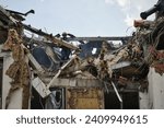 Small photo of Kyiv, Ukraine - June 26th 2022 - Russia launched missile attacks to Kyiv, local officials reported. Rescuers work at the site of a damaged building after a missile strike.