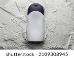 Small photo of Plastic bottle on white baby cosmetic talcum powder background. Mock up, flat lay.