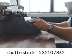 Man Working On Retro Typewriter ...