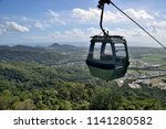 The cable car zips through the tropical rainforest of Cairns, in Northern Queensland, Australia.