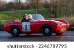 Small photo of Stony Stratford, Bucks, UK, Jan 1st 2023. 1958 red Berkeley Twosome classic British sports car driving on an English country road