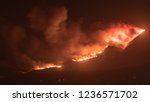 Small photo of Firestorm Fire and clouds Woolsey Fire Hill in Los Angeles Malibu California Post Apocalyptic