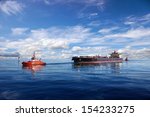 Tanker Ship Being Guided Into...