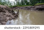 Small photo of Turbid River Water With A Muddy Ground Surface, In The Village Of Belo Laut In The Afternoon