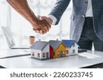 Small photo of Lawsuits against Real estate agent and realtor general liability insurance businessman professional discussing and consultant with house toy model building shaking hands after sign a contract
