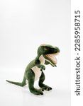 Small photo of Tyrannosaurus or trex dinosaur toy in green