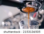 Small photo of Close-up of espresso pouring from coffee machine.Professional coffee brewing.Barista make coffee latte art with espresso machine in cafe vintage color tone.Espresso speed bar shot.beverage food cafe.