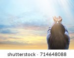 Girl praying and worship to GOD.woman praying to GOD in the morning.teenager woman hand praying,Raised Hands in prayer on the sky in the morning concept for faith, spirituality and religion.