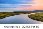 The ergun River and the birds in the sky in the sunset, aerial scenery, Heilongjiang, China