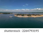Small photo of Sandbanks is an affluent neighbourhood of Poole, Dorset, on the south coast of England, situated on a narrow spit of around 1 km² or 0.39 sq mi extending into the mouth of Poole Harbour.