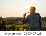 Small photo of Wine producer man tasting the product after harvest and grape fermentation process - Vinification, organic quality product and small business concept - Main focus on hand