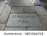 Small photo of Plymouth England. August 2020. Large granite stone with MAYFLOWER 1620 thereon in footpath alongside the Mayflower steps, Barbican, where the Pilgrim fathers embarked for the New World September 1620
