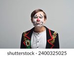 Small photo of Circus clown. Emotions. Chagrin