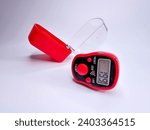 Small photo of Digital tally counter "tasbih" with the cover isolated on white background.