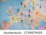 Many figures of people are placed on Europe map. Open borders concept.