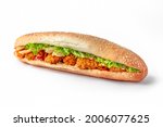 Sandwich with fresh baguette, chicken nuggets, tomatoes, lettuce and cucumbers for take away or food delivery isolated on a white background.