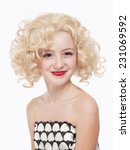 Small photo of Portrait of a Young Girl with Blond Wig Posing as Marylin Monroe