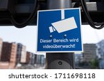 Small photo of Sign "This area is under video surveillance" translated "Dieser Bereich wird videouberwacht"