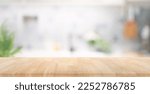 Small photo of Selective focus.Wood table top on blur kitchen counter background.For montage product display or design key visual layout.