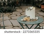 Small photo of wedding cake, bride and groom cutting the cake, tuscan luxury boho rustic style wedding decor