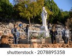 Small photo of Medjugorje, Bosnia and Herzegovina. 2021-11-07. Statue of the Blessed Virgin Mary on Mount Podbrdo, the Apparition hill overlooking the village of Medjugorje in Bosnia and Herzegovina.