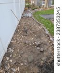 Small photo of A lawn smothering project after tarps have been removed, which killed the grass beneath them