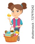 little caucasian girl holding a ... | Shutterstock .eps vector #727979242