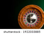 Wooden roulette isolated on black background