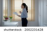 Small photo of Young female leader, asia people lady or mba student happy standing smile look at in front of mirror pep talk for sale pitch hold paper document script public speak skill for job career self improve.