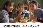Small photo of Asia teen girl vlogger group look camera VoIP talk on reel IG tiktok app filming shoot live share vlog. Gen Z youth people enjoy food dinner lunch at reopen cafe with fun joy party laugh relax smile.