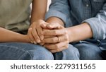 Small photo of Middle aged asia people old mom holding hands trust comfort help young woman talk crying stress relief at home. Mum as friend love care hold hand adult child feel pain sad worry of life crisis issues.