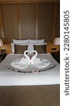 Small photo of A turndown 10th wedding anniversary on the hotel bed