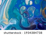 Abstract fluid art background navy blue and golden colors. Liquid acrylic painting on canvas with turquoise gradient and splash. Watercolor backdrop with waves pattern.